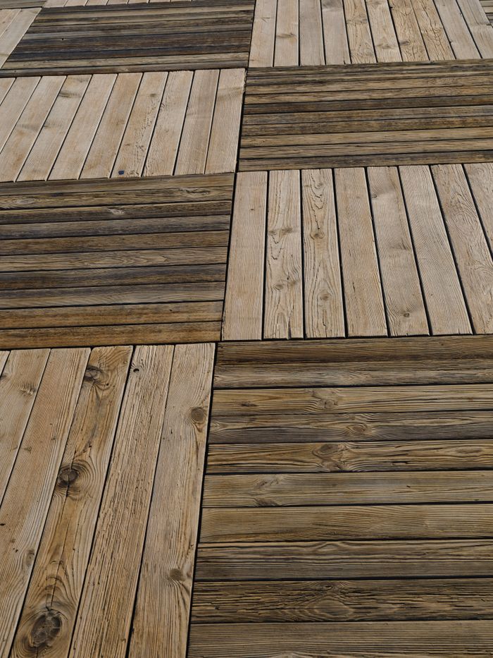 Close-up view of wooden panel flooring showing natural wood grain and patterns.